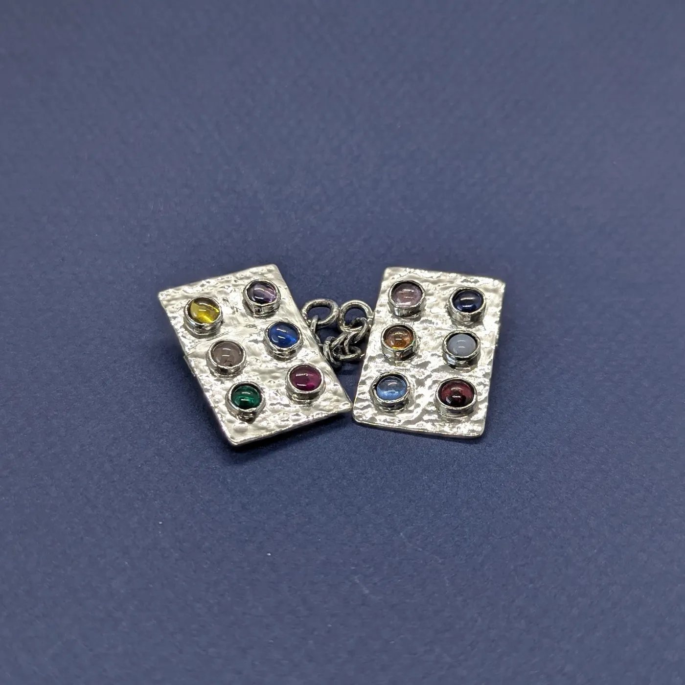 Handcrafted silver and gold pieces with colored stones by Affinia